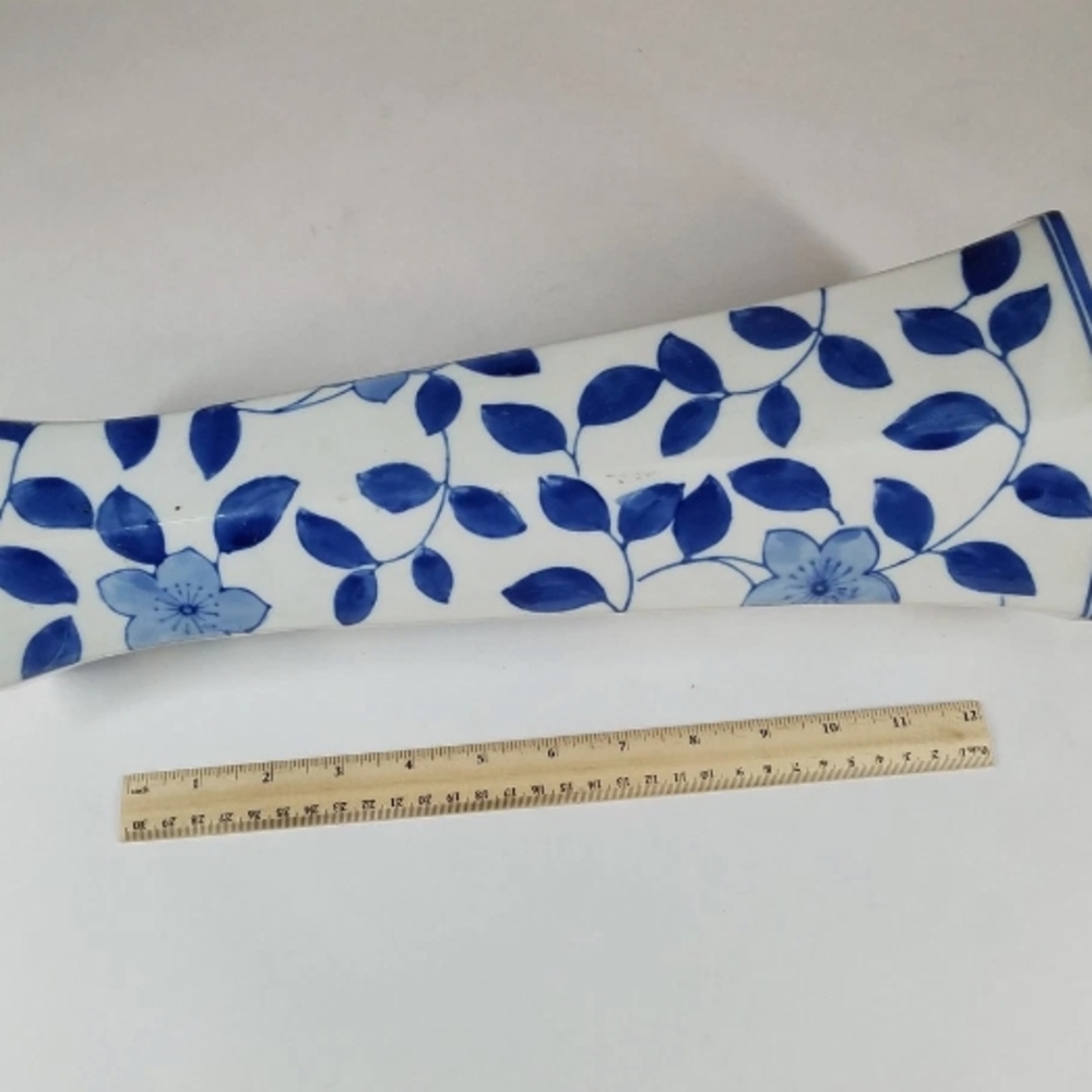 Blue and White Ceramic Art Piece with Floral Design